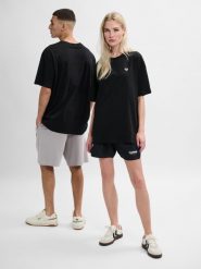 Koszulka Hummel Loose Bee. Czarne bluzki sportowe damskie HUMMEL, m, z aplikacjami, z bawełny, bez kołnierzyka. Za 144.55 zł.