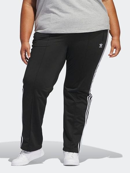 Adidas Spodnie dresowe w kolorze czarnym rozmiar: 2X. Czarne spodnie dresowe damskie Adidas, bez wzorów, z dresówki. Za 169.67 zł.