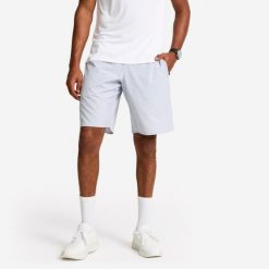 Spodenki fitness cardio męskie Domyos. Niebieskie szorty męskie DOMYOS, bez wzorów, z materiału, sportowe. Za 79.99 zł.