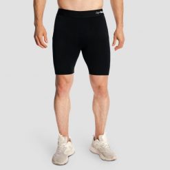 Szorty męskie sporty walki slim czarne Combat. Czarne szorty męskie GYMBEAM, z elastanu, bez kołnierzyka. Za 101.90 zł.