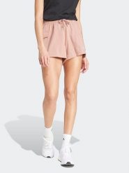 Adidas Szorty dresowe w kolorze jasnoróżowym rozmiar: M. Różowe szorty damskie Adidas, bez wzorów, z dresówki. Za 96.60 zł.
