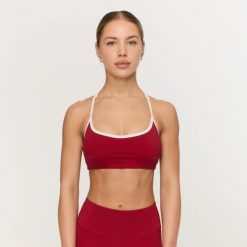 Biustonosz sportowy damski fitness czerwony Varsity. Czerwone biustonosze sportowe damskie GYMBEAM, bez wzorów, z elastanu. Za 84.90 zł.