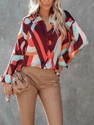 Milan Kiss Bluzka ze wzorem rozmiar: XL. Bluzki damskie Milan Kiss, xl, bez wzorów, bez kołnierzyka, bez ramiączek. Za 130.99 zł.