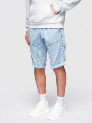 Krótkie jeansowe spodenki męskie z ozdobnymi przeszyciami - jasnoniebieskie V2. Niebieskie szorty męskie Ombre Clothing, z bawełny, bez kołnierzyka. W wyprzedaży za 69.99 zł.