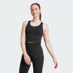 Koszulka na ramiączkach All Me z wbudowanym biustonoszem o średnim wsparciu. Czarne bluzki sportowe damskie Adidas, l, z elastanu, bez kołnierzyka, bez ramiączek. Za 219.00 zł.
