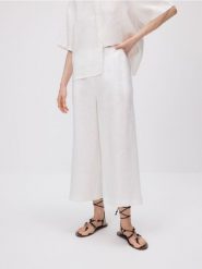 Lniane spodnie culotte - biały. Białe spodnie materiałowe damskie Reserved, bez wzorów. W wyprzedaży za 109.99 zł.