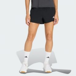 Szorty do ćwiczeń Essentials 2in1. Białe spodenki sportowe damskie Adidas, bez wzorów, sportowe. Za 179.00 zł.