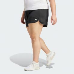 Szorty Pacer Essentials Knit High-Rise (Plus Size). Czarne spodenki sportowe damskie Adidas, bez wzorów, z materiału, sportowe. Za 139.00 zł.