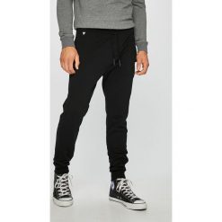 Guess Jeans - Spodnie. Niebieskie spodnie materiałowe męskie Guess Jeans, z aplikacjami, z bawełny, casualowe. W wyprzedaży za 219.90 zł.