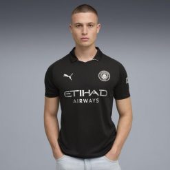 Koszulka piłkarska Puma Manchester City 25/26. Bluzki damskie Puma, s, bez wzorów, z materiału, sportowe, bez kołnierzyka, bez ramiączek. Za 459.99 zł.