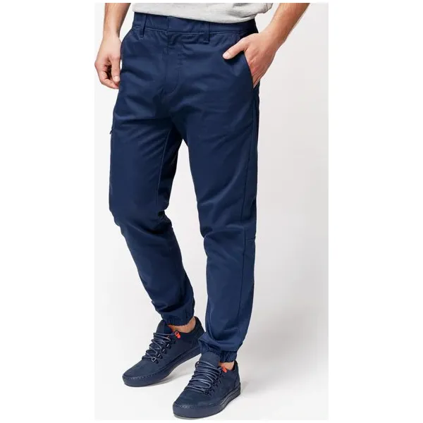 Timberland Spodnie Lovell Lake Slim Tapered Utility Jogger , granatowy, rozmiar 30/32. Niebieskie spodnie materiałowe męskie Timberland, bez wzorów, z bawełny, klasyczne, z standardowym stanem. W wyprzedaży za 279.99 zł.