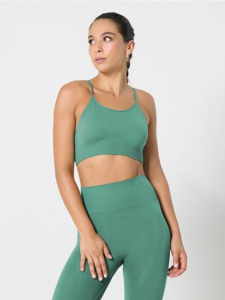 Stanik sportowy - zielony. Zielone biustonosze sportowe damskie Sinsay, bez wzorów. Za 19.99 zł.