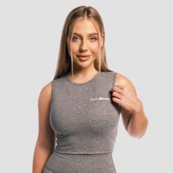 Crop top damski fitness slim bez rękawów Core Storm. Topy sportowe damskie GYMBEAM, s, bez wzorów, z materiału, bez ramiączek. Za 63.90 zł.