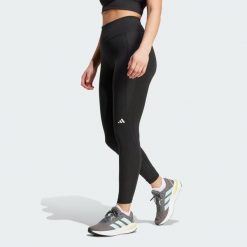 Damskie legginsy 7/8 adidas Own the Run. Czarne legginsy sportowe damskie Adidas, xs, bez wzorów, z materiału, do biegania. W wyprzedaży za 209.25 zł.