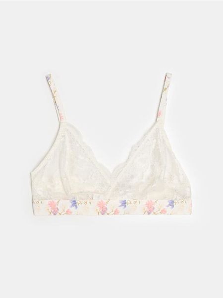 Koronkowy miękki biustonosz z motywem kwiatowym - kremowy. Białe biustonosze Sinsay, bez wzorów, z koronki. Za 19.99 zł.