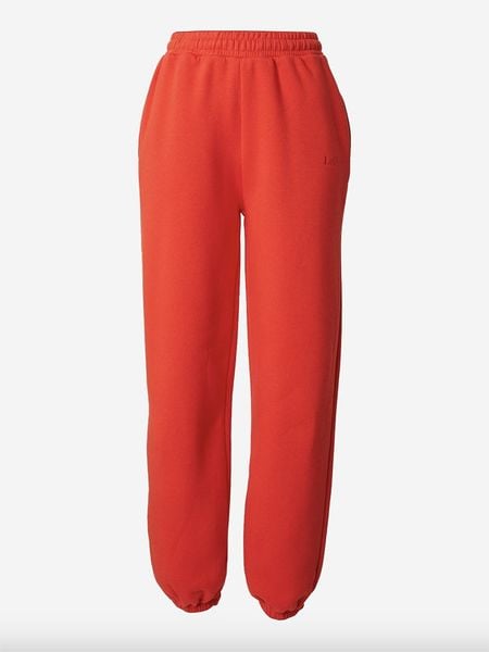 LeGer Spodnie dresowe "Karima" w kolorze czerwonym rozmiar: 42. Czerwone spodnie dresowe damskie LeGer, bez wzorów, z bawełny. Za 119.68 zł.
