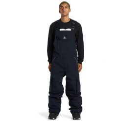 Spodnie snowboardowe męskie DC Shoes Brigade 45K kombinezon. Białe spodnie materiałowe męskie DC Shoes, bez wzorów, z poliesteru, sportowe. Za 701.00 zł.