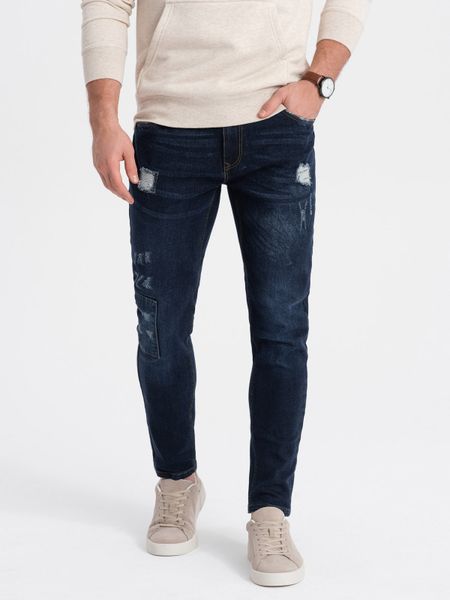 Spodnie męskie jeansowe SKINNY FIT - ciemnoniebieskie - Rozmiar: L. Niebieskie spodnie materiałowe męskie Ombre Clothing, bez wzorów, z bawełny. W wyprzedaży za 69.99 zł.