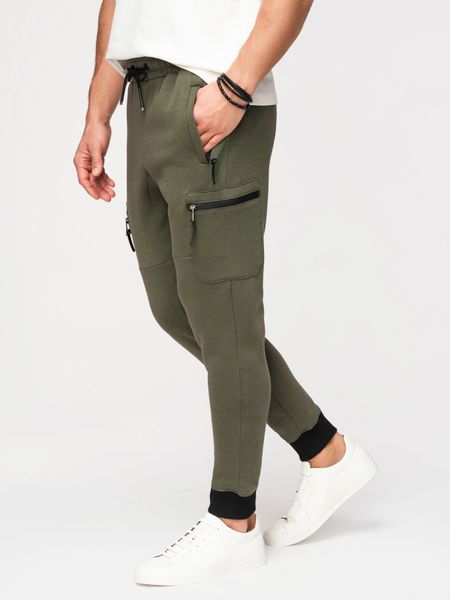 Spodnie dresowe męskie JOGGER z kieszeniami na udach i kontrastującymi wstawkami - oliwkowe V5. Zielone spodnie dresowe męskie Ombre Clothing, bez wzorów, z dresówki. Za 149.99 zł.