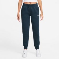 Spodnie sportowe damskie Nike Nsw Phnx Flc. Niebieskie spodnie dresowe damskie Nike, bez wzorów, z dresówki. Za 403.00 zł.