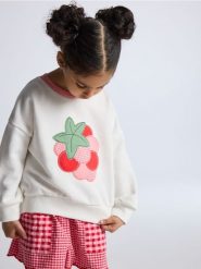 Bluza z aplikacją - złamana biel. Bluzy i bluzki niemowlęce Reserved, z aplikacjami, z bawełny, bez ramiączek, bez kaptura. Za 49.99 zł.