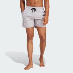 Szorty Stripey Classics Swim Short Length. Czarne szorty męskie Adidas, bez wzorów, z materiału, eleganckie. Za 129.99 zł.