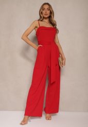 Czerwony Taliowany Kombinezon z Paskiem Desine. Czerwone kombinezony damskie Renee, bez wzorów, eleganckie, bez kołnierzyka, bez ramiączek, długie. Za 74.99 zł.