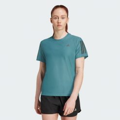 Koszulka Own The Run. Niebieskie t-shirty damskie Adidas, l, bez wzorów, z materiału, bez kołnierzyka. Za 149.00 zł.