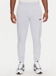 Puma Spodnie dresowe Ess 684714 Fioletowy Regular Fit. Fioletowe spodnie dresowe męskie Puma, bez wzorów, z bawełny. Za 129.99 zł.
