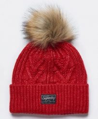 Superdry czapka Cable Lux z warkoczowym splotem i pomponem – Flame Marl. Brązowe czapki męskie Superdry., bez wzorów, z futra. Za 98.60 zł.