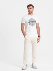 Męskie spodnie dresowe z nogawką bez ściągacza - kremowe V11. Białe spodnie dresowe męskie Ombre Clothing, bez wzorów, z bawełny. W wyprzedaży za 127.49 zł.