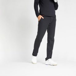 Spodnie do golfa męskie Inesis CW500 ciepłe. Czarne spodnie materiałowe męskie INESIS, bez wzorów, z elastanu, sportowe. Za 179.99 zł.