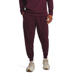 Spodnie dresowe męskie Under Armour Fleece Joggers. Czerwone spodnie dresowe męskie Under Armour, bez wzorów, z dresówki. Za 179.99 zł.