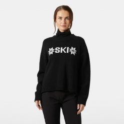 Damski sweter z dzianiny Helly Hansen Bliss. Czarne swetry klasyczne damskie Helly Hansen, na zimę, z dzianiny, bez kołnierzyka. Za 727.00 zł.