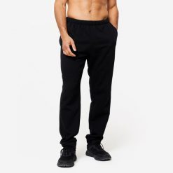 Spodnie dresowe męskie Domyos Gym & Pilates 100. Czarne spodnie dresowe męskie DOMYOS, z bawełny. Za 49.99 zł.
