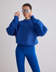 Damska bluza biegowa oddychająca, odprowadzająca wilgoć Le Run błękitna. Niebieskie bluzy bez kaptura damskie Aim'n, l, z bawełny. Za 381.00 zł.