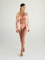 Góra od bikini z ochroną UV - brzoskwiniowy. Pomarańczowe bikini damskie Reserved, bez wzorów. W wyprzedaży za 39.99 zł.