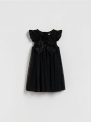 Sukienka z kokardą - czarny. Czarne sukienki dziewczęce Reserved, bez wzorów, z materiału, bez ramiączek. Za 69.99 zł.