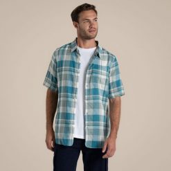 Koszula Craghoppers Argino. Niebieskie koszule męskie CRAGHOPPERS, m, bez wzorów, bez kołnierzyka, bez ramiączek. W wyprzedaży za 258.05 zł.