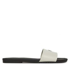 Klapki Calvin Klein Jeans. Białe klapki damskie Calvin Klein Jeans, bez wzorów, z jeansu, bez obcasa. Za 209.99 zł.