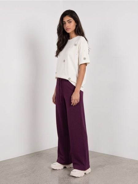Spodnie wide leg z domieszką wiskozy - różowy. Czerwone spodnie materiałowe damskie Sinsay, l, z wiskozy. Za 49.99 zł.