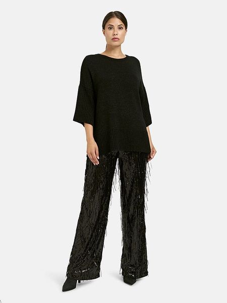 Milano Italy Spodnie w kolorze czarnym z cekinami rozmiar: 34. Czarne spodnie materiałowe damskie Milano Italy, bez wzorów, z materiału, z podwyższonym stanem. Za 252.99 zł.