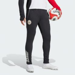 Spodnie treningowe Ajax Amsterdam Tiro 25 Competition. Białe spodnie dresowe męskie Adidas, bez wzorów, z dresówki. Za 279.00 zł.