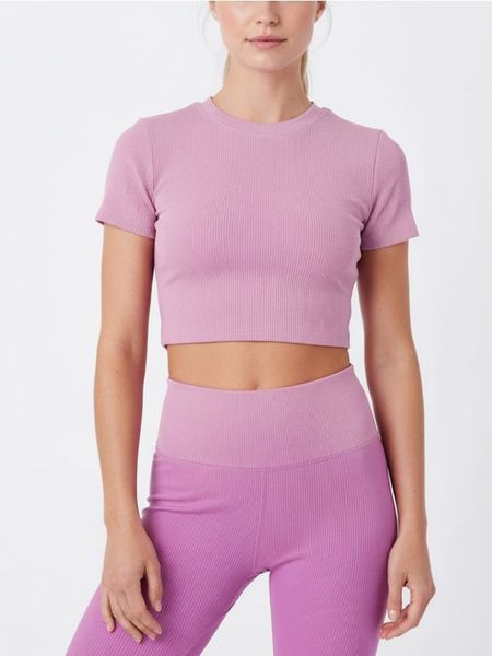 Sportowy top w prążki - różowy. Czerwone topy sportowe damskie Sinsay, l, bez wzorów, bez ramiączek. Za 25.99 zł.