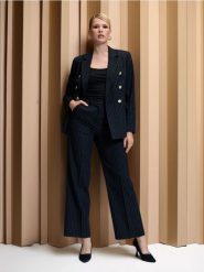 Eleganckie spodnie w paski - granatowy. Niebieskie spodnie materiałowe damskie Sinsay, bez wzorów, eleganckie. Za 49.99 zł.