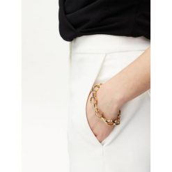Bransoletka Guess. Żółte bransoletki damskie Guess, złote. Za 269.99 zł.