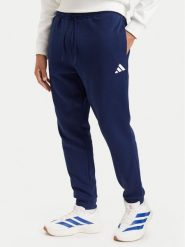 Adidas Spodnie dresowe Essentials Feelcozy JE3814 Niebieski Regular Fit. Niebieskie spodnie dresowe męskie Adidas, bez wzorów, z bawełny. Za 219.99 zł.