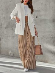 Milan Kiss Spodnie w kolorze kremowo-brązowym rozmiar: XL. Brązowe spodnie materiałowe damskie Milan Kiss, bez wzorów, z bawełny, z podwyższonym stanem. Za 165.99 zł.