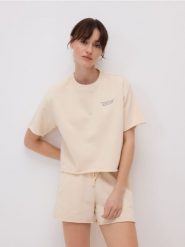 Bawełniany t-shirt - jasnożółty. Żółte t-shirty damskie Reserved, l, bez wzorów, z bawełny, bez kołnierzyka. W wyprzedaży za 45.99 zł.