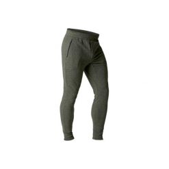 Spodnie skinny Gym & Pilates 500 męskie. Brązowe spodnie materiałowe męskie DOMYOS, bez wzorów, z bawełny. W wyprzedaży za 49.99 zł.